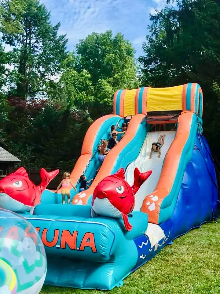 Bounce house rental setup in New Jersey backyard